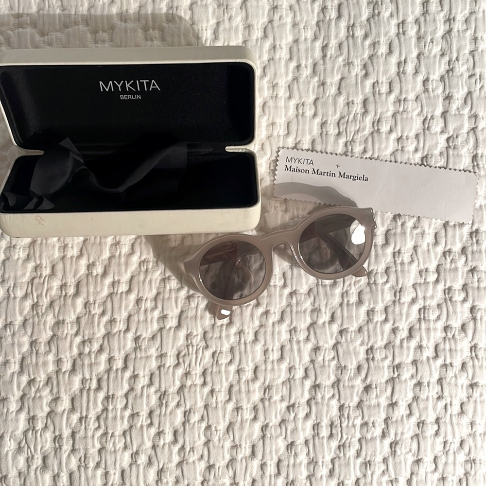 Mykita x Maison Margiela grey round sunglasses straight arms transparent design